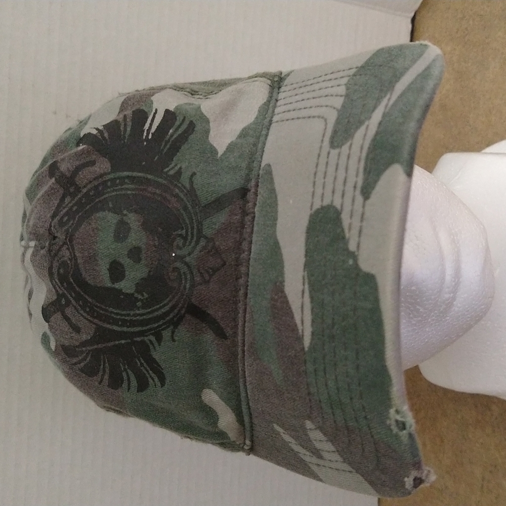 VGUC. Distressed camouflage skull baseball cap.